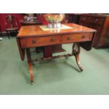 A George III revival sofa table the rising leaves over two frieze drawers on a lyre end base and