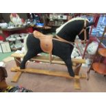 A Mamas & Papas child's rocking horse