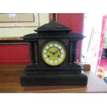 A slate architectual form mantel clock with brass face, with key