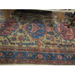 An Eastern rug, blue and beige with three central guls, 150cm x 82cm