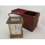 A leather cased brass carriage clock