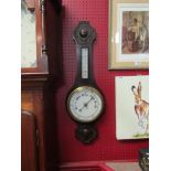 An early 20th Century oak cased banjo barometer 76cm Length.