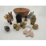 A shell bowl containing miscellaneous Buddhas, brass dogs, Radley dog leather fob etc