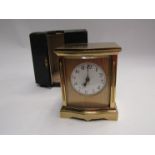A leather cased brass carriage clock with French movement, a/f with cracks to dial.