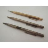 Two silver propelling pencils marked Birmingham + London and a 'yard-o-led' rolled gold example