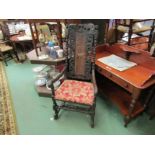 A 17th Century style oak heavily carved elbow chair, bergere back, a/f
