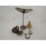 A candlestick, brass paperweight, two fob watches including 0.935 and pocket watch case (5)