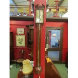 An inlaid mahogany stick barometer by Norwich maker. Indistinctly signed. a/f