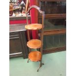 An Art Deco walnut three shelf folding cake stand