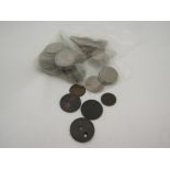 A small quantity of British coins including half crowns and three penny coins