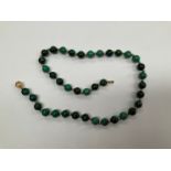 A green jasper bead necklace with gold clasp stamped 585, 41cm