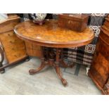 A Victorian walnut oval top occassional table with four pillar supports to quatraform base, 74cm
