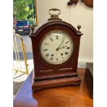 An Edwardian mahogany cased bracket clock in the Regency style, twin train movement, Roman dial,