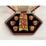 A Royal Worcester Demi-tasse coffee set decorated with painted fruit, Ayrton, Moseley and Townsend