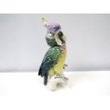 A Karl Ens figure of a Cockatoo, 27.5cm tall.