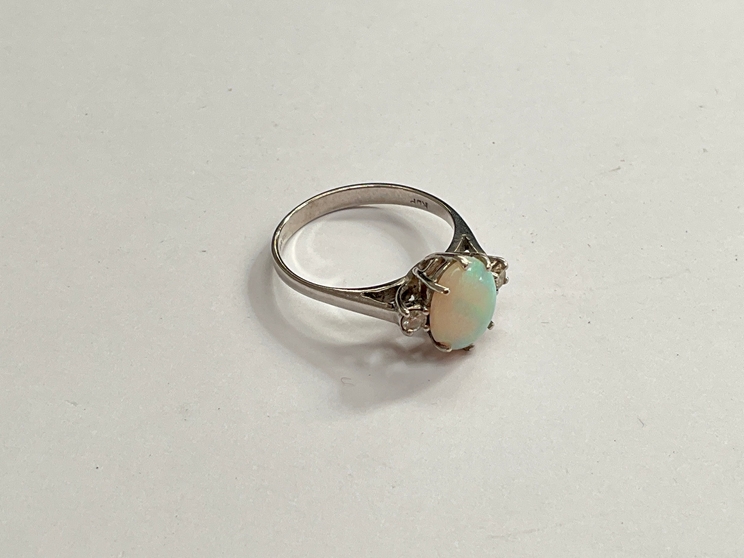 An 18ct white gold opal and diamond ring. Size K, 2.3g