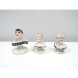 Three Pierrette china doll heads, 4cm & 5cm tall.