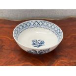 A circa 1780 Worcester blue and white porcelain bowl, floral sprays and butterflies, chip to foot,