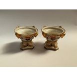 A pair of 19th Century Derby potpourri pedestal bowls, enriched with gilt, a/f, 11cm tall