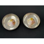 A pair of Sanders and Mackensie silver trinket dishes each with a Royal Worcester roundel