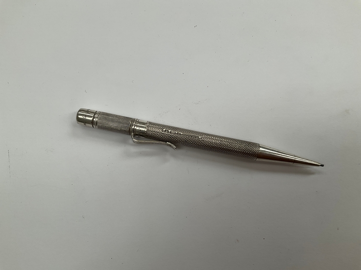 A Sampson and Morden silver propelling pencil, engraved 'From Me To You'