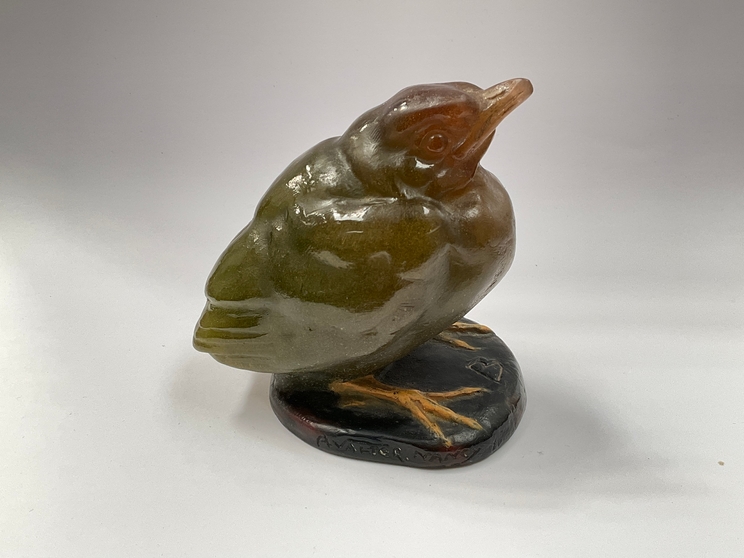 A circa 1920's French glass paperweight of a fledgling by Almaric Walter signed A.Walter, Nancy. 9.