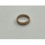 A 9ct gold two tone band size T, 5g