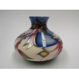 A Moorcroft Ivory Bells Design Trial squat form vase designed by Philip Gibson, 12.7.04, 10.5cm