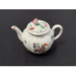 A First Period Worcester fluted form tea pot decorated with floral sprays and a floral knop, 14cm