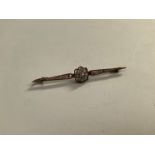 A floral diamond bar brooch, unmarked, 3.9g