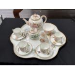 A Worcester floral decorated teaset for four comprising of four cups and saucers, teapot, lidded