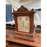 A Whytock & Sons of Dundee bracket clock, silvered dial, Roman numerated with walnut carved case,