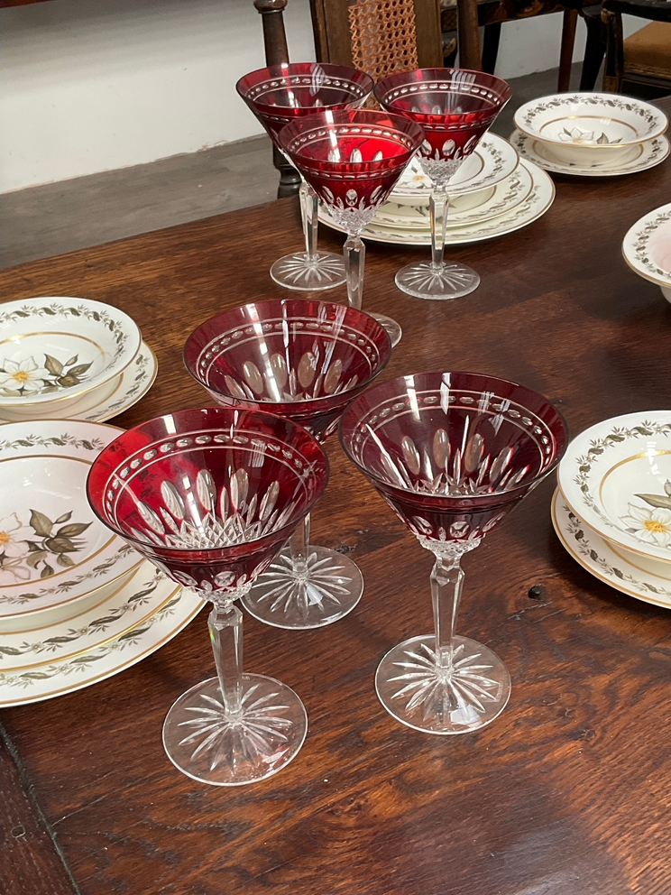 A set of 24 Waterford crystal ruby glass champagne saucers in the Bohemian style