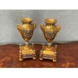 A pair of late 19th / early 20th Century gilt metal garnitures, scrolled enamelled detail, urn form,