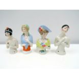 Four early 20th Century glazed china half-dolls including Pierrette, tallest 9cm tall.