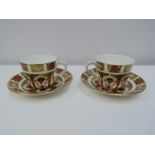 A pair of Royal Crown Derby Imari cups and saucers