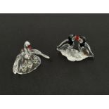 A boxed Swarovski crystal figure of two puffins and another of a swan