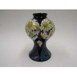 A Moorcroft Spring Daisies pattern vase, designed by Paul Hilditch, 27/50, 16cm tall, boxed