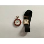 An 18ct gold cased lady's wristwatch, rounded square face, black ribbon strap, and a gold fob