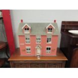 A Dolls House with contents "High Street"