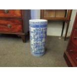 A cylindrical blue and white stick stand/floor vase with floral decoration, 44cm high