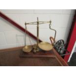 An Edwardian set of brass Gardner (Wandsworth) counter scales on mahogany base with various weights