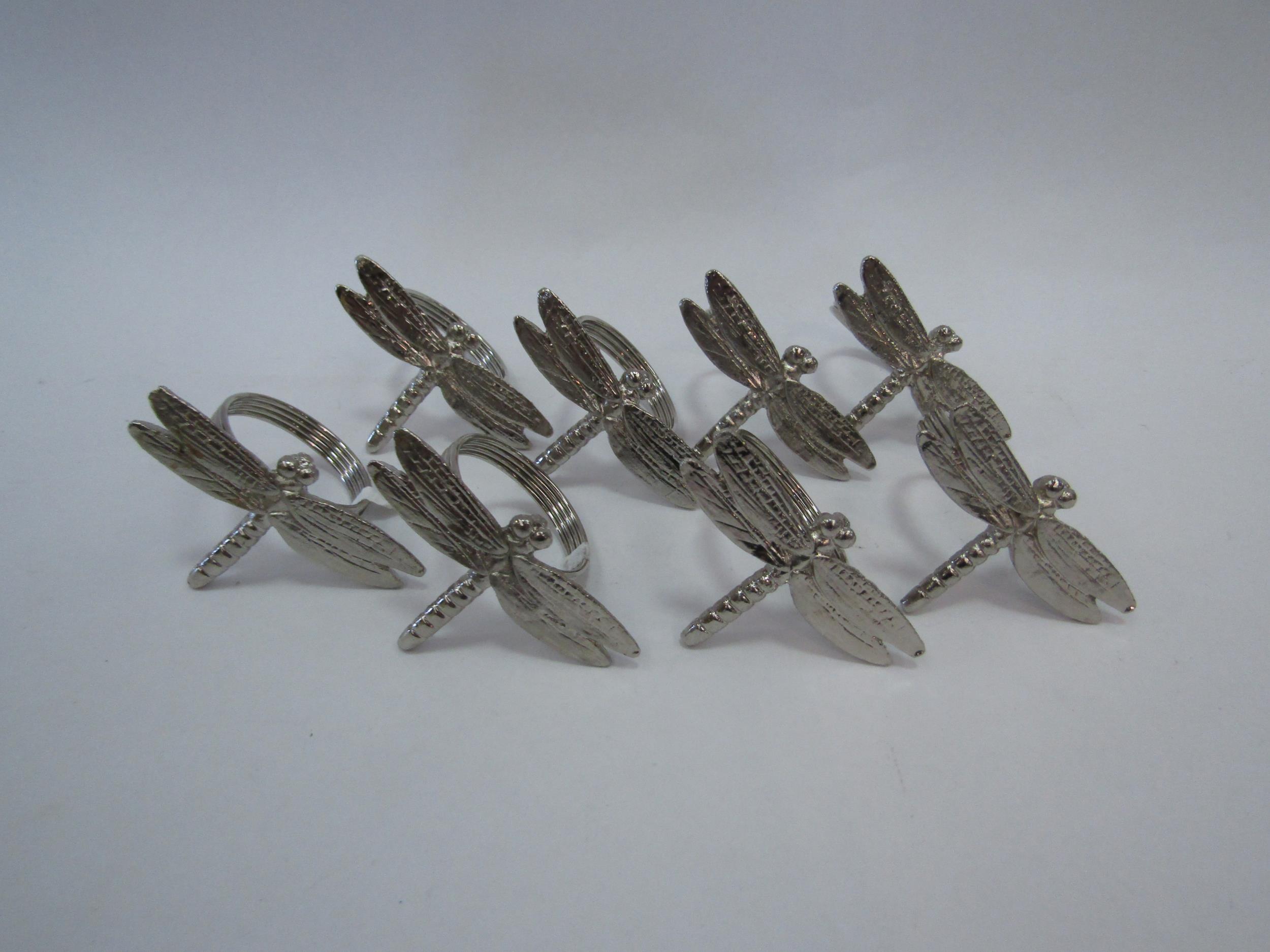 A quantity of dragonfly design napkin rings