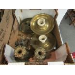 Two boxes of copper and brass wares including teapots, candlesticks etc