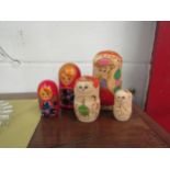 Three sets of wooden Russian dolls including nativity example