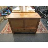 A 19th Century stripped pine mule chest with front decoration 72cm x 94cm x 43cm