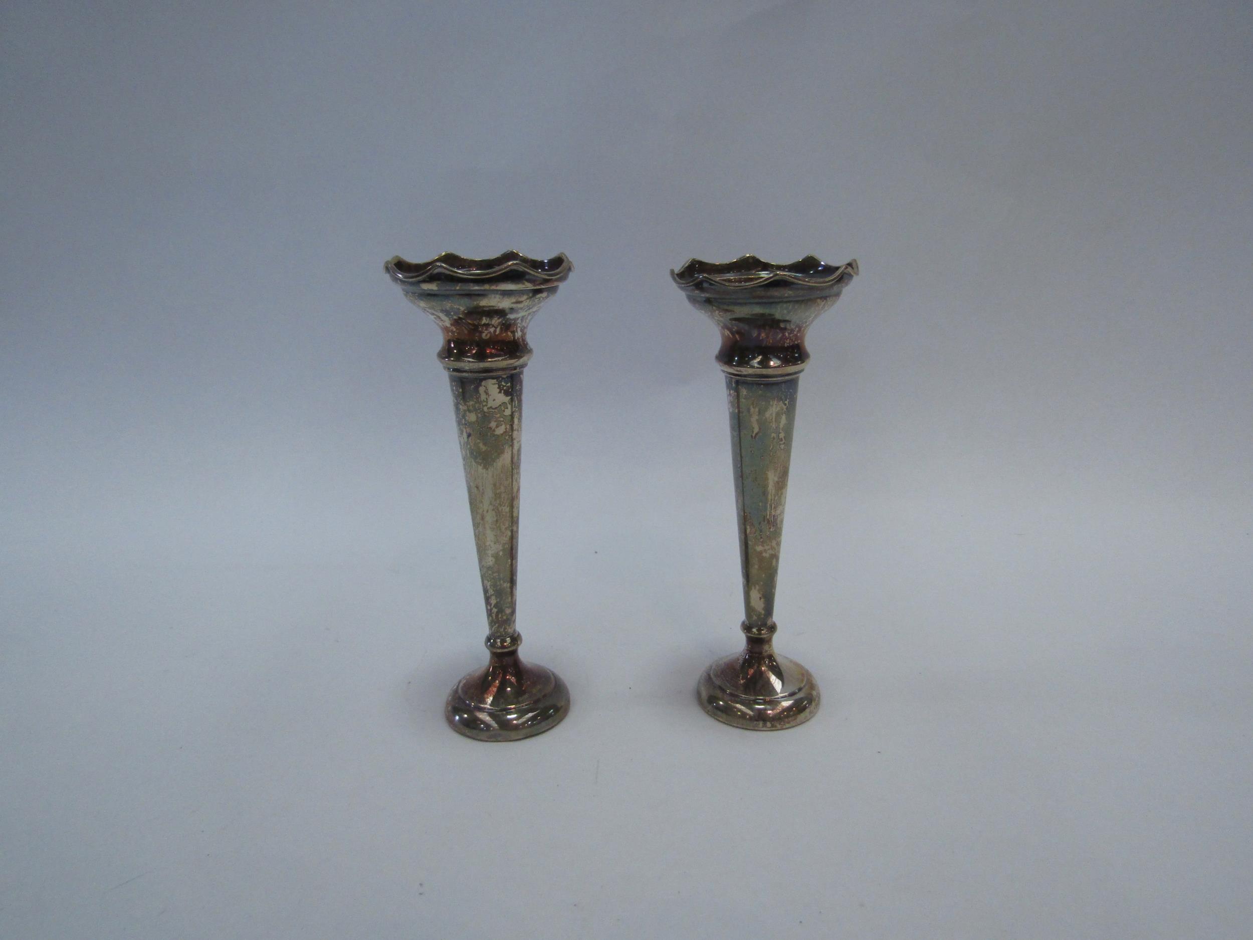 A pair of silver stem vases, 13cm high