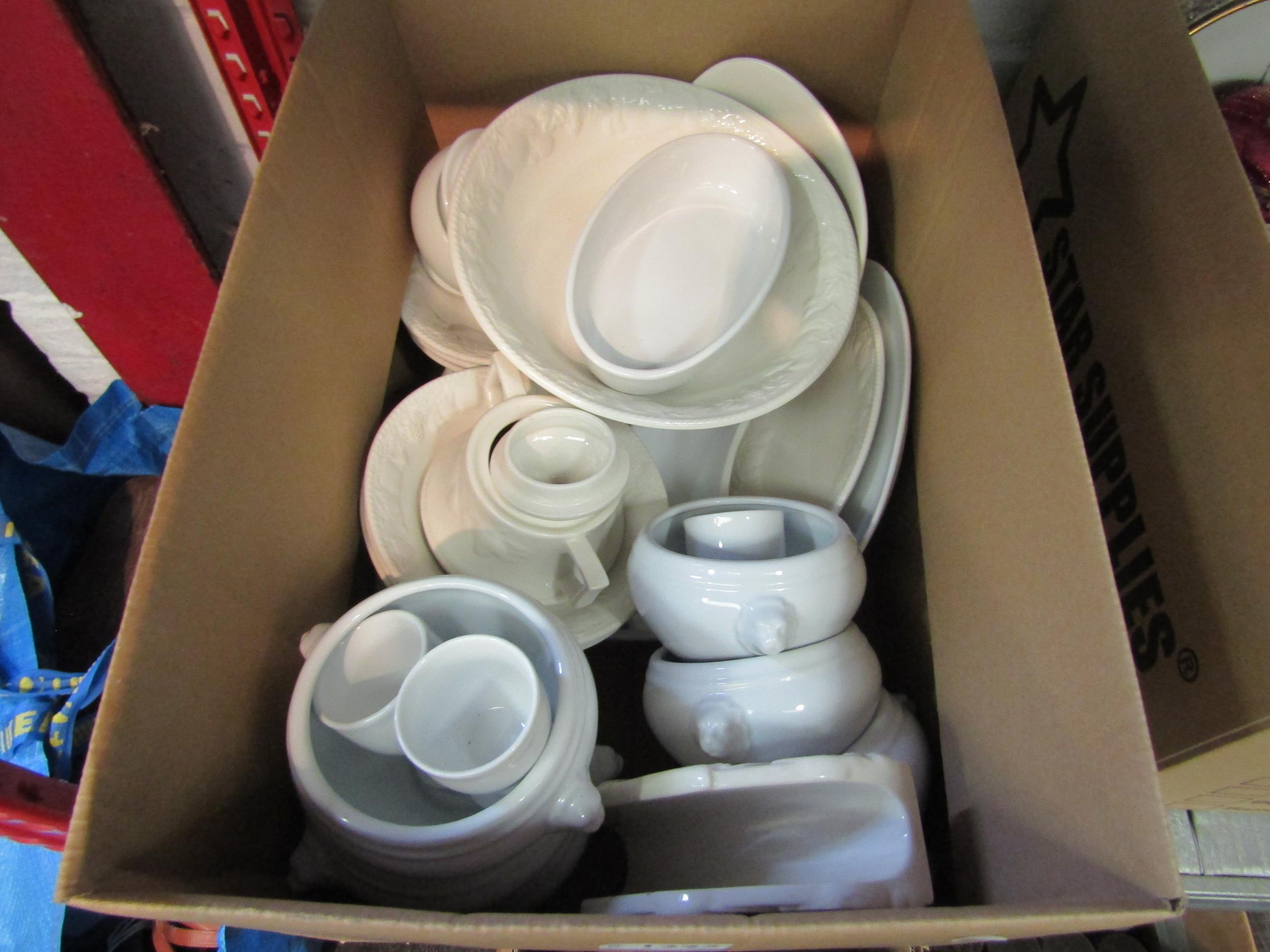 A box of white ceramics including soup dishes, bowls etc