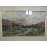 J.C.UREN: (1845-1932) A watercolour of Manay Valley, Dartmoor, framed and glazed in a gilt frame,