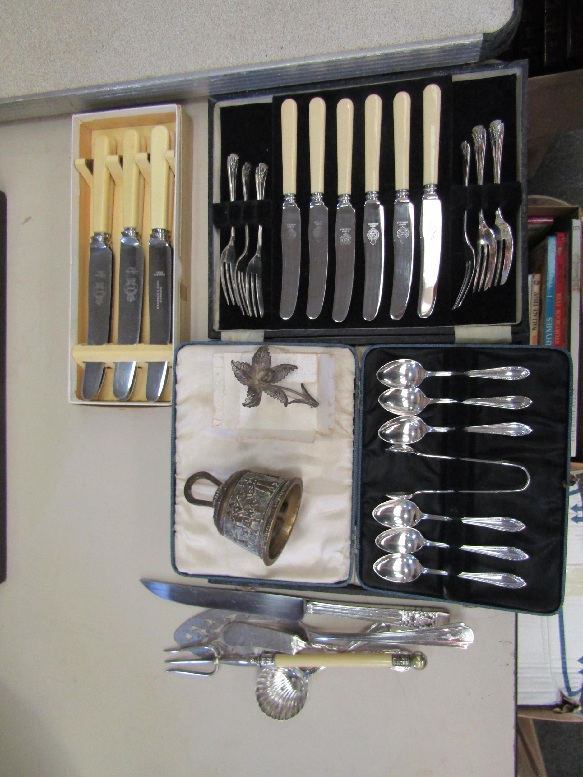 A selection of silver plated and brass wares including cased cutlery sets, community plate knife,